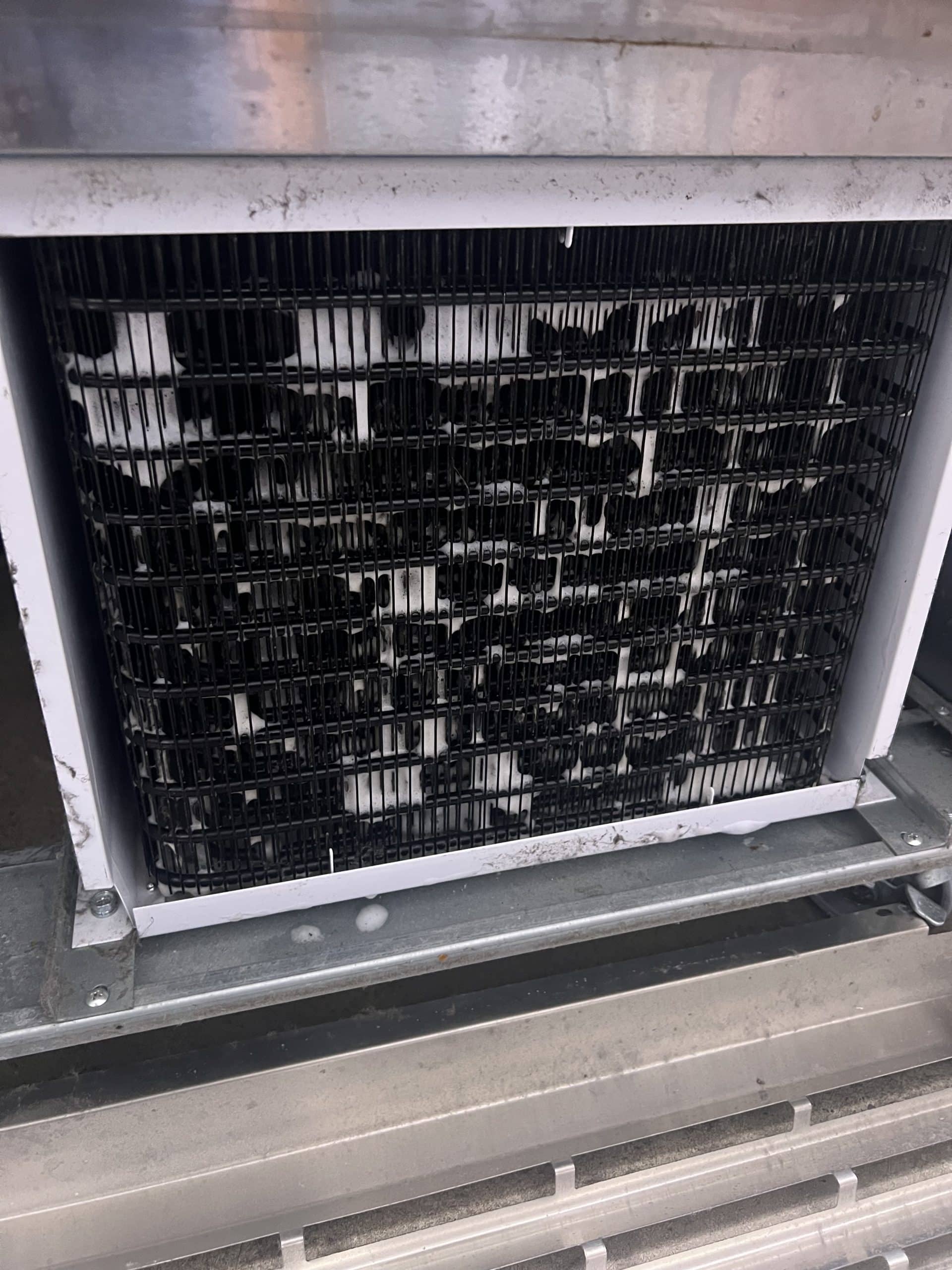 Coils fully cleaned, clear airflow restored.