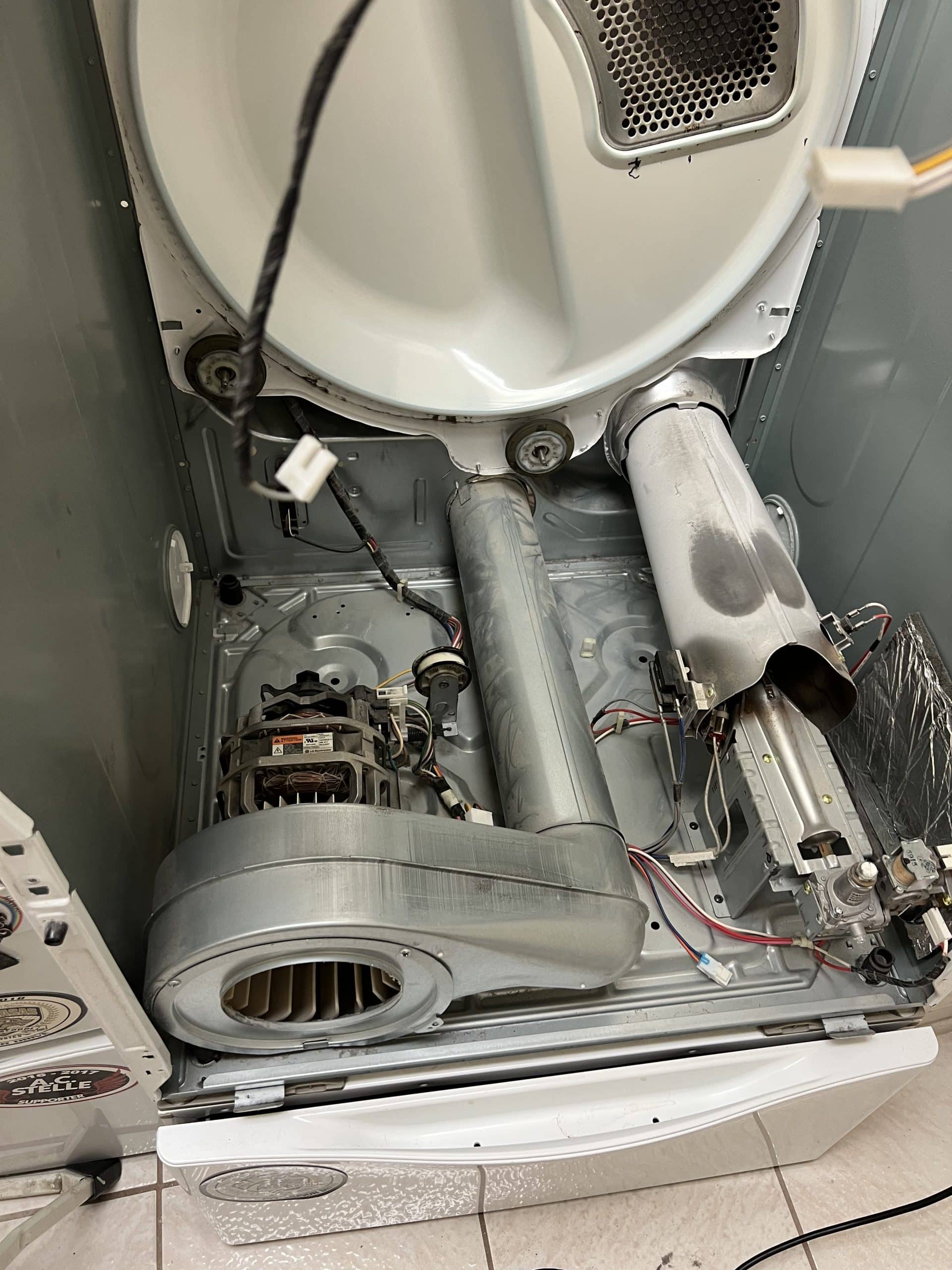 Opened dryer showing internal components